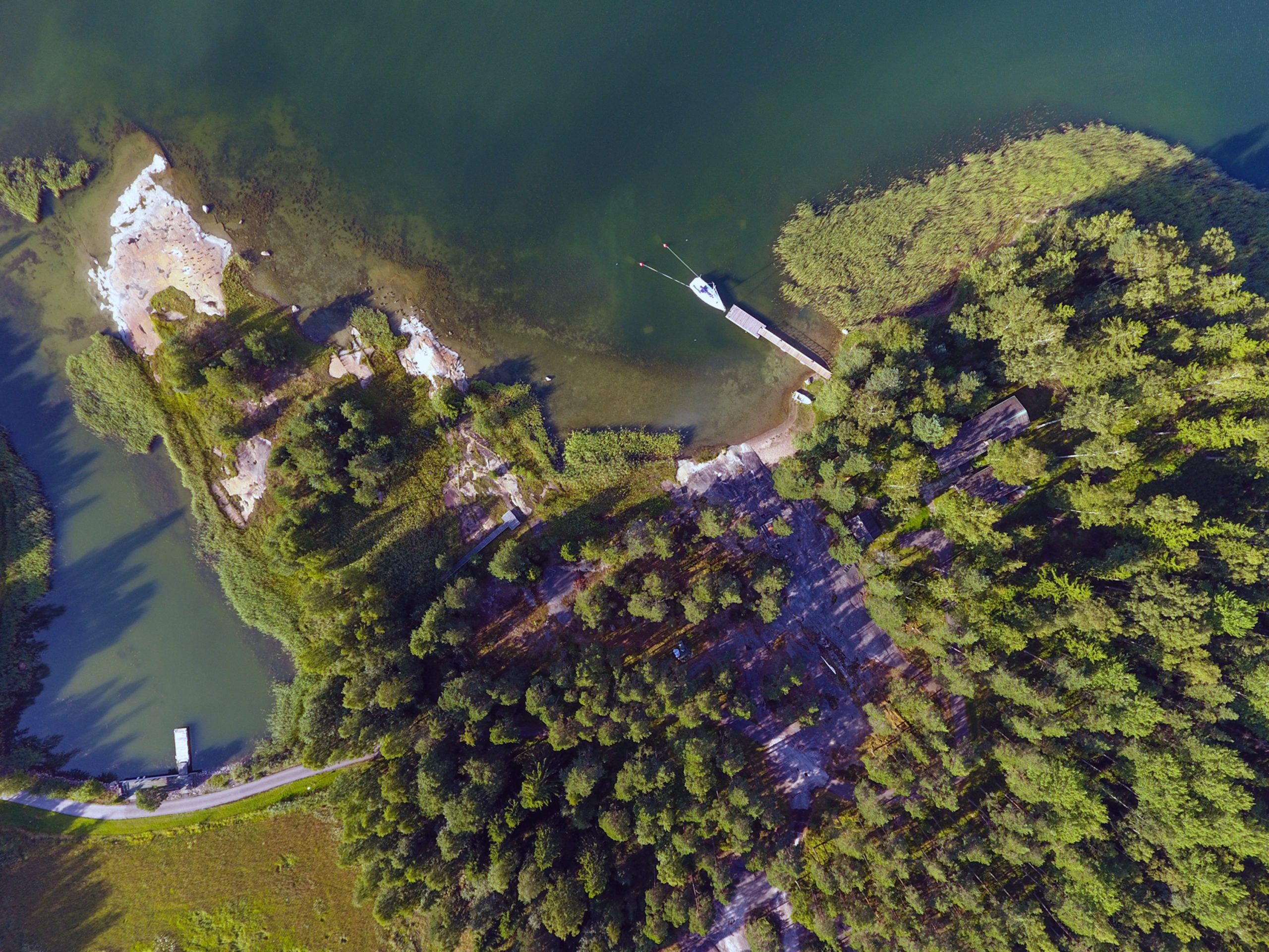 Aerial view of a private coastal peninsula with dock access in the Finnish Archipelago.